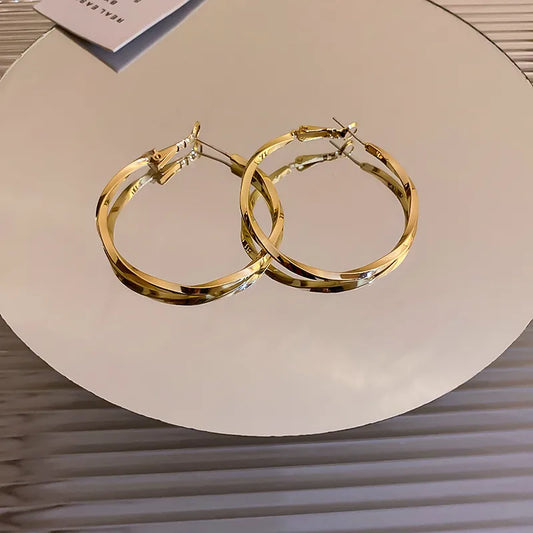 Golden Twirl Hoop Earrings